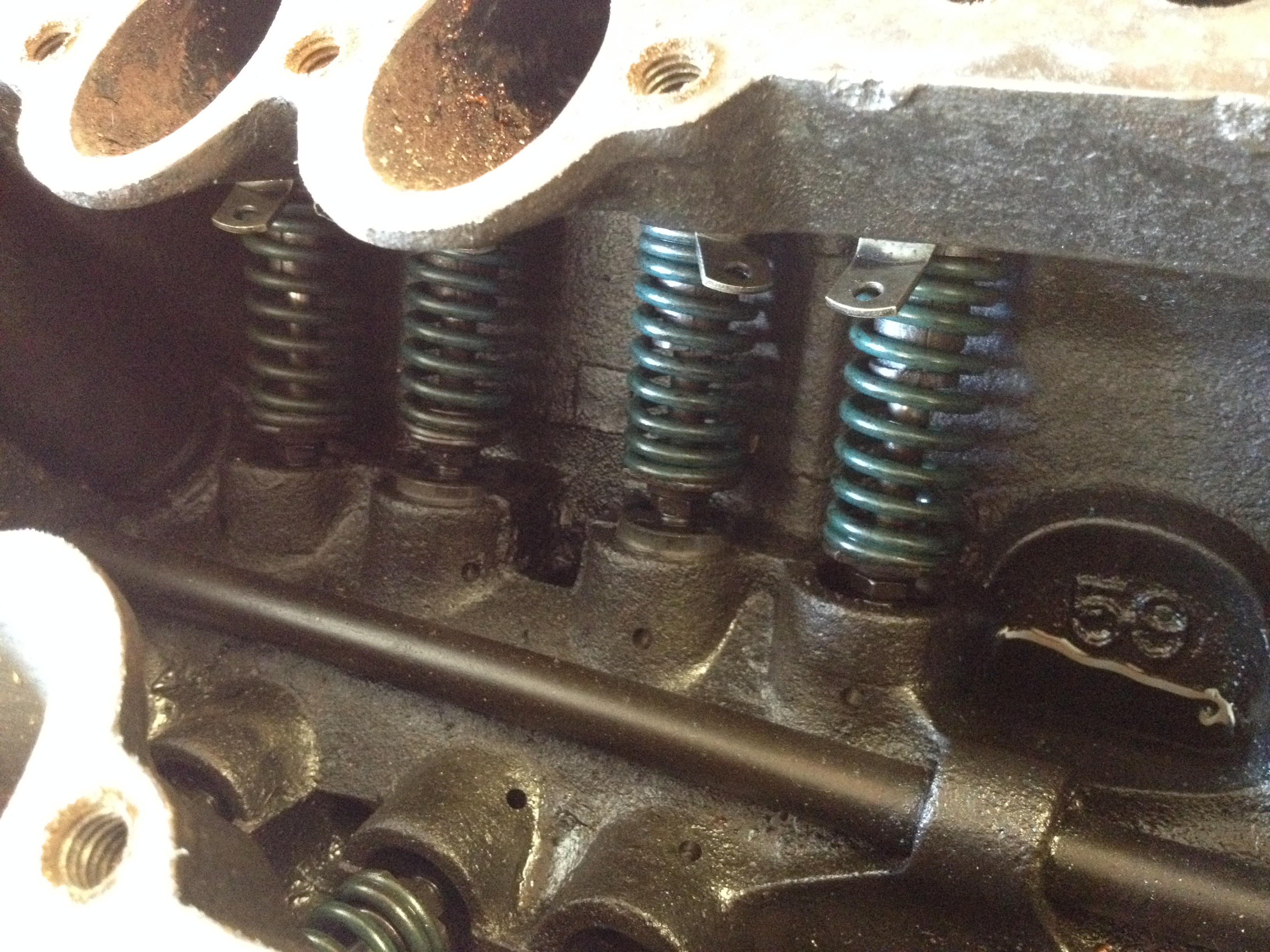 Looks pretty clean and fresh down under the intake manifold, although I did discover a stuck valve on the other side.  